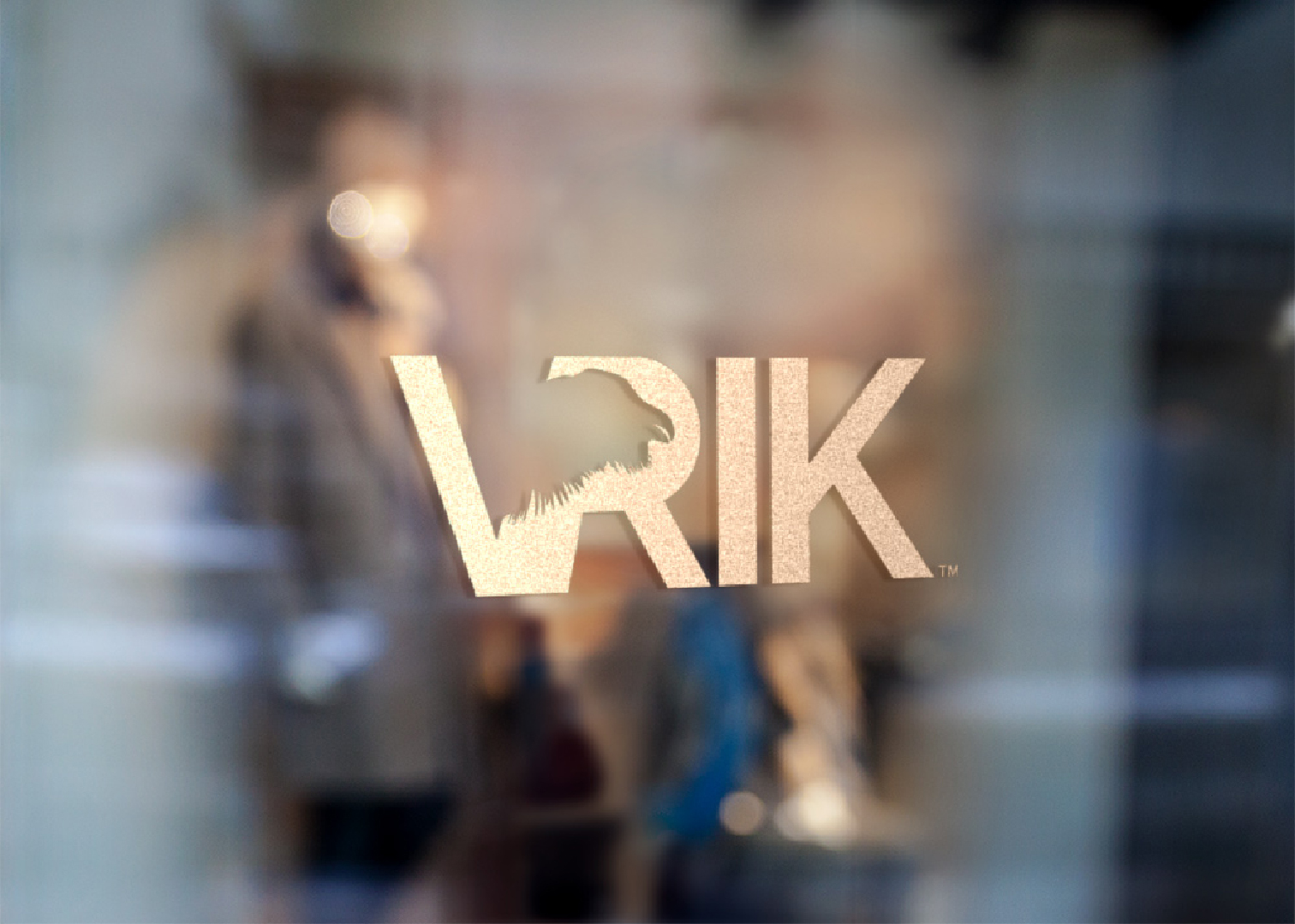 VRIK logotyp on a window in gold-wrap